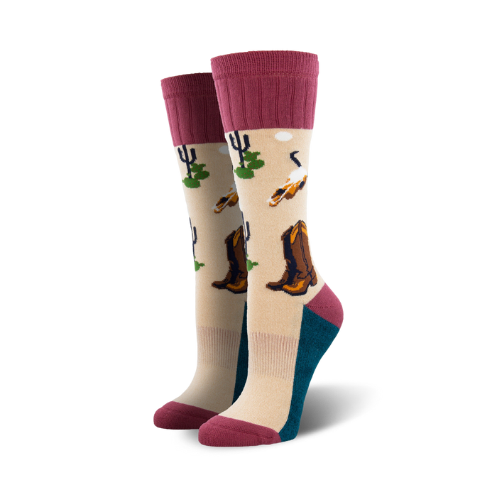 beige boot socks with pink ribbed cuff feature pattern of cowboy boots, cacti, and skulls.   }}
