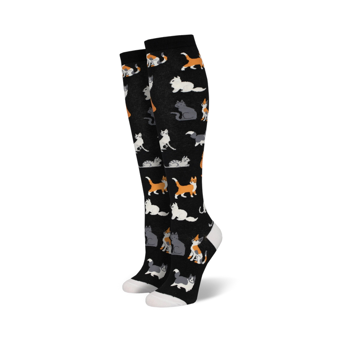 black knee high vibrant cartoon cat socks with white toe, heel, and foldover band for women.    }}