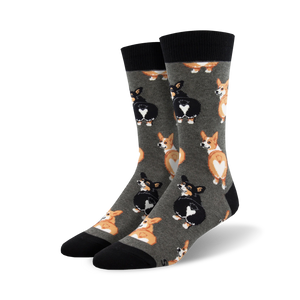 Pair of crew socks, grey and black, featuring a repeating pattern of corgi butts with heart-shaped markings.