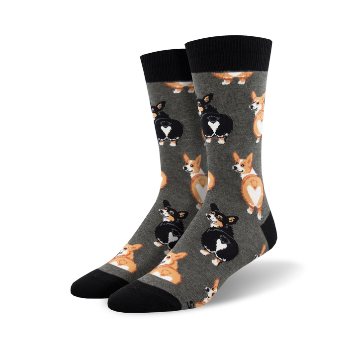 Pair of crew socks, grey and black, featuring a repeating pattern of corgi butts with heart-shaped markings.