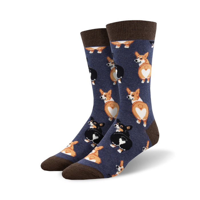 Close-up view of a pair of navy blue crew socks with a pattern of corgi butts. The socks have brown cuffs.