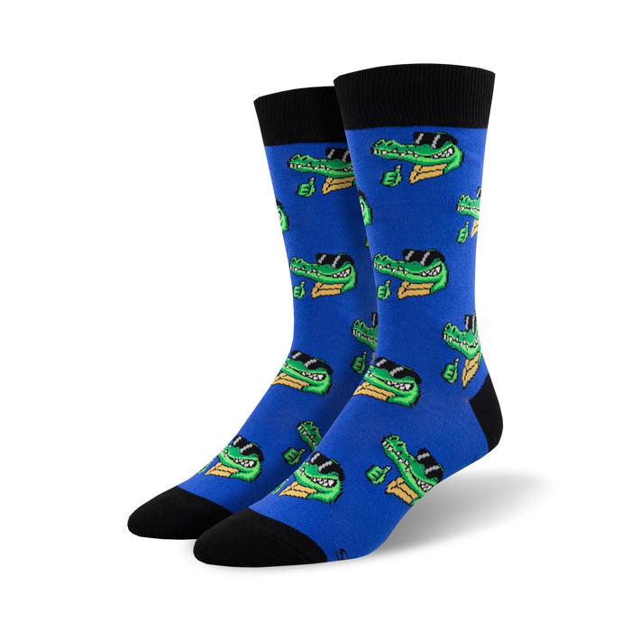Pair of blue crew socks featuring a repeating pattern of cartoon crocodiles wearing sunglasses and giving a thumbs up. }}