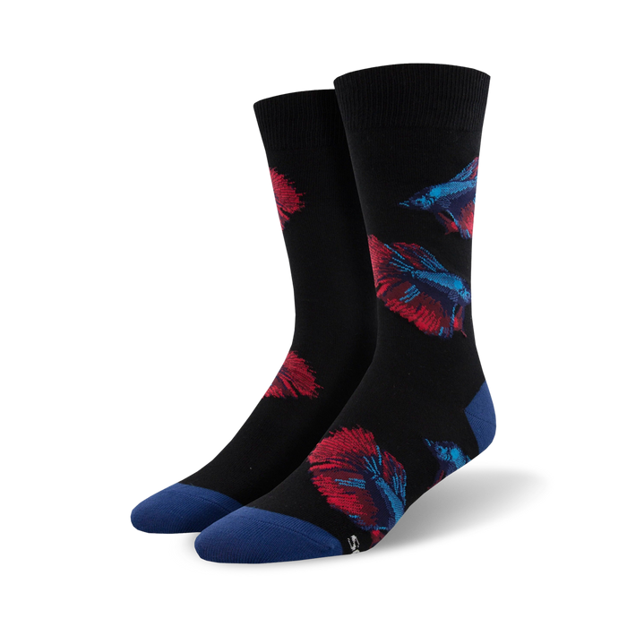 Pair of black crew socks with red and blue betta fish designs. Features a navy blue cuff. }}