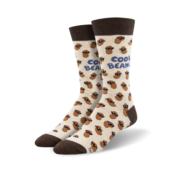 A pair of cream crew socks with brown bean characters wearing sunglasses. The socks have a 'Cool Beans' text and brown cuffs. }}