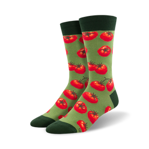 Pair of crew socks with a repeating pattern of red tomatoes on a green background.  Dark green cuffs.