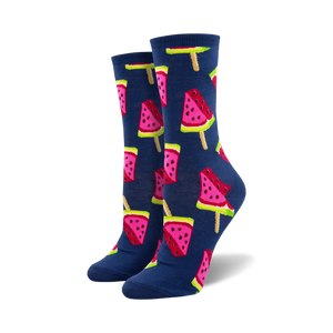 Lifestyle shot of a person's feet wearing the navy blue watermelon popsicle socks.