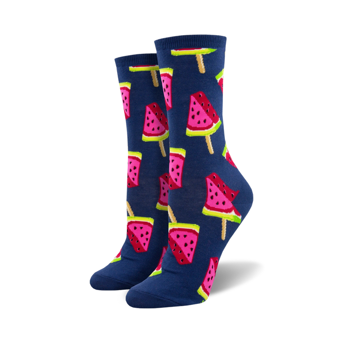 Lifestyle shot of a person's feet wearing the navy blue watermelon popsicle socks.