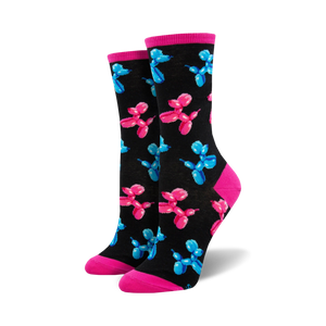Pair of women's crew socks. Black background with repeating pattern of pink and blue balloon animal dogs. Pink and light blue cuffs.