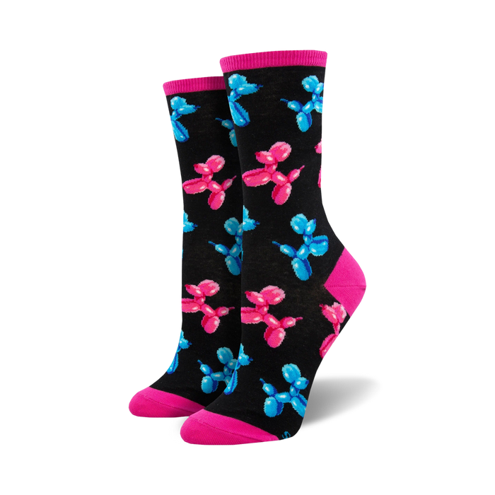 Pair of women's crew socks. Black background with repeating pattern of pink and blue balloon animal dogs. Pink and light blue cuffs.