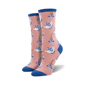 Pair of crew socks in pink and blue, featuring a pattern of teapots pouring tea into cups.