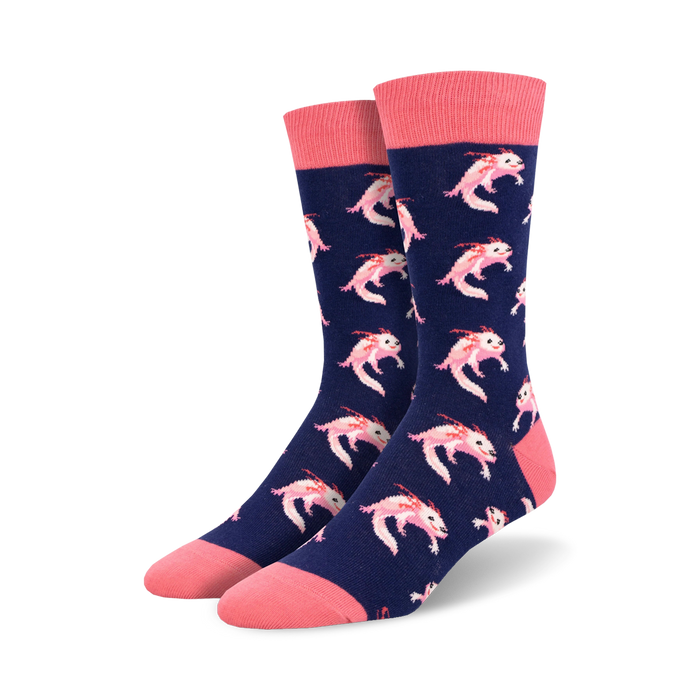 Pair of navy blue crew socks with a repeating pattern of pink axolotls.  The socks have coral pink cuffs. }}