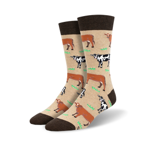 light brown men's crew socks with pattern of brown and white cows standing on green grass.   