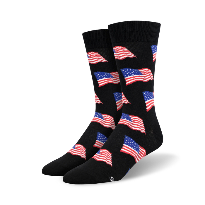 Pair of black crew socks with a repeating pattern of small American flags in red, white, and blue. }}