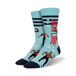 Pair of crew socks; light blue with navy details, red stripes, and pixelated lucha libre wrestlers; text reads 'Lucha Libre'.