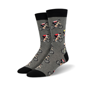 Pair of crew socks; gray with repeating cyclist pattern, black cuffs; or light blue with navy cuffs and same cyclist pattern.
