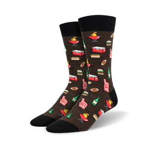 Pair of crew socks in brown and green, featuring a pixelated design of burgers, hot dogs, beer, and footballs.