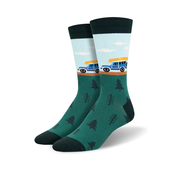 Crew socks in teal, light blue, and dark green. Design features a blue jeep carrying a yellow canoe and small pine trees. }}