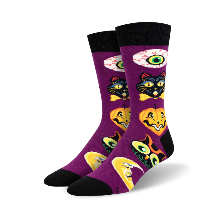 halloween themed purple crew socks with black toe and heel with a moon, cat, pumpkin, and eyeball motif.    }}