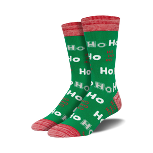 Lifestyle shot showing the green 'Ho Ho Ho' socks on a person's feet.