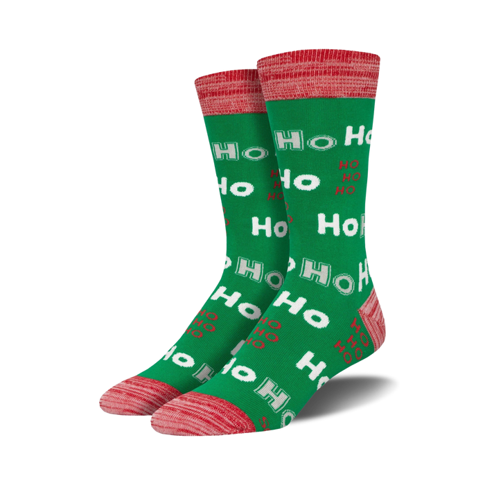 Lifestyle shot showing the green 'Ho Ho Ho' socks on a person's feet.