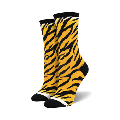 Pair of crew socks in orange and black with a tiger stripe pattern.  Black toe and heel.