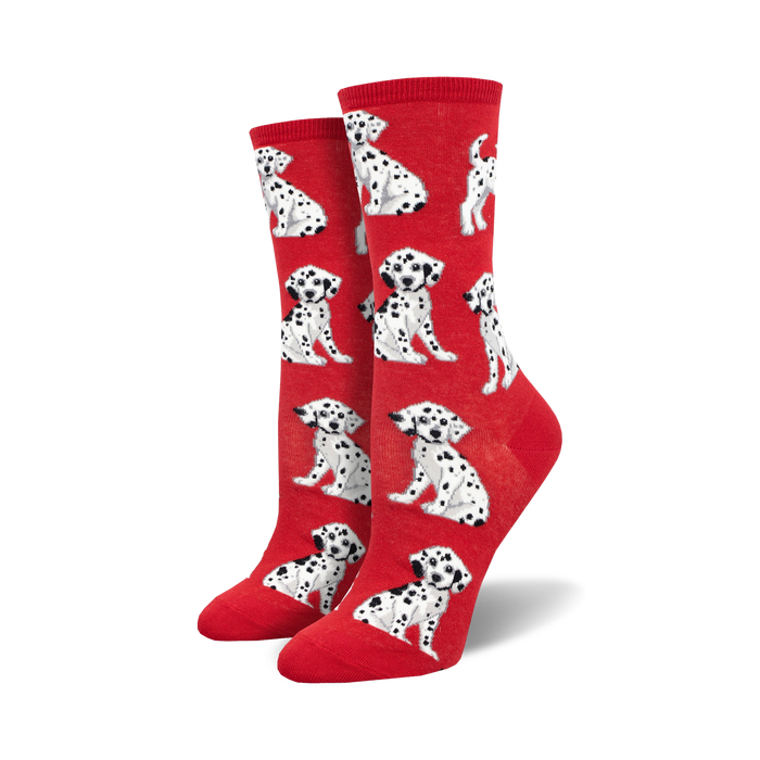 Pair of red crew socks with a repeating pattern of adorable black-and-white Dalmatian puppies.