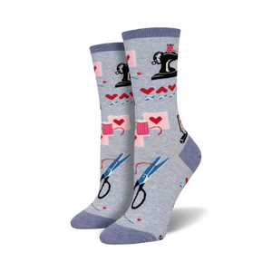 light blue women's crew socks with pattern of sewing-related symbols including scissors, thread, sewing machine, and hearts.  
