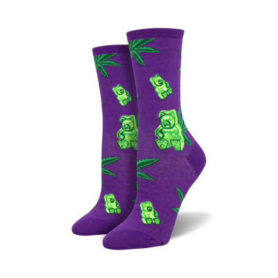 Pair of women's crew socks. Purple socks showcase green gummy bears and marijuana leaves. Black socks show the same design on a black background.