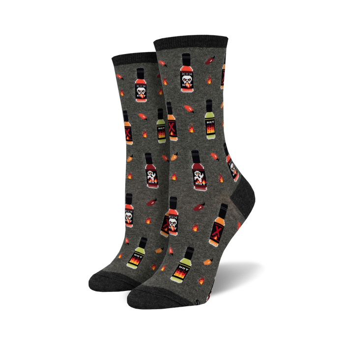 Pair of women's crew socks in grey with a repeating pattern of pixelated hot sauce bottles, skulls, and chili peppers. }}