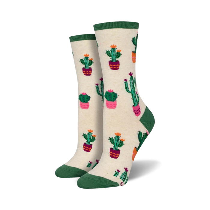 Cream crew socks with a fun pattern of cacti in pink and green pots. Green and cream cuffs.