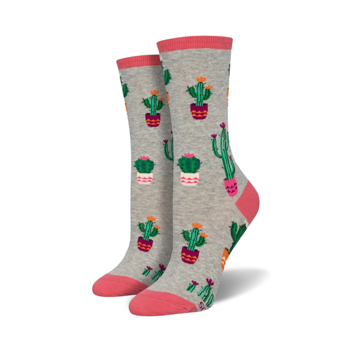 gray crew socks with a vibrant pattern of cacti in pots. perfect for cactus lovers who want to add a touch of whimsy to their wardrobe. comfortable and durable.  