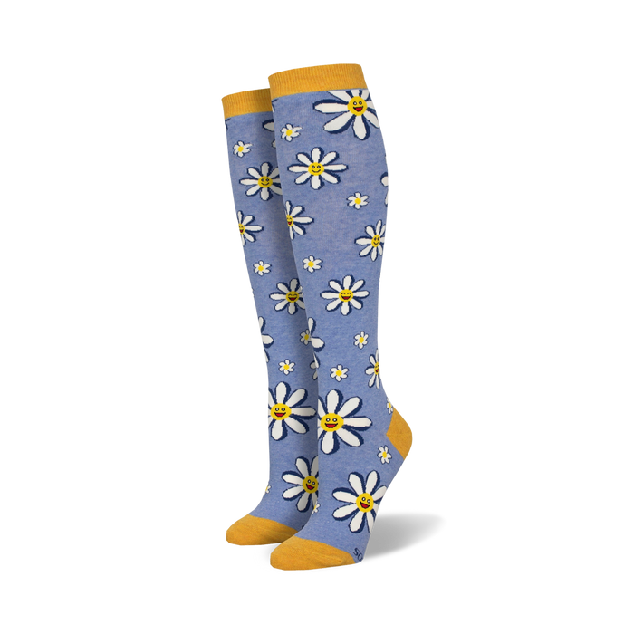 knee-high daisy patterned socks with a light blue background, perfect for adding a cheerful touch to any outfit.   