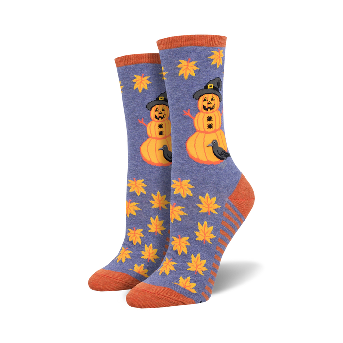 womens halloween-themed crew socks. blue with pattern of fall leaves and pumpkin with witch hat and crow.   