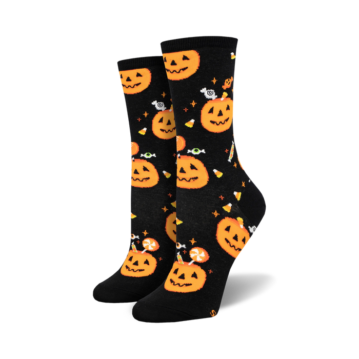 Pair of black crew socks with orange pumpkins, candy corn, and eyeballs.  Fun Halloween design! }}