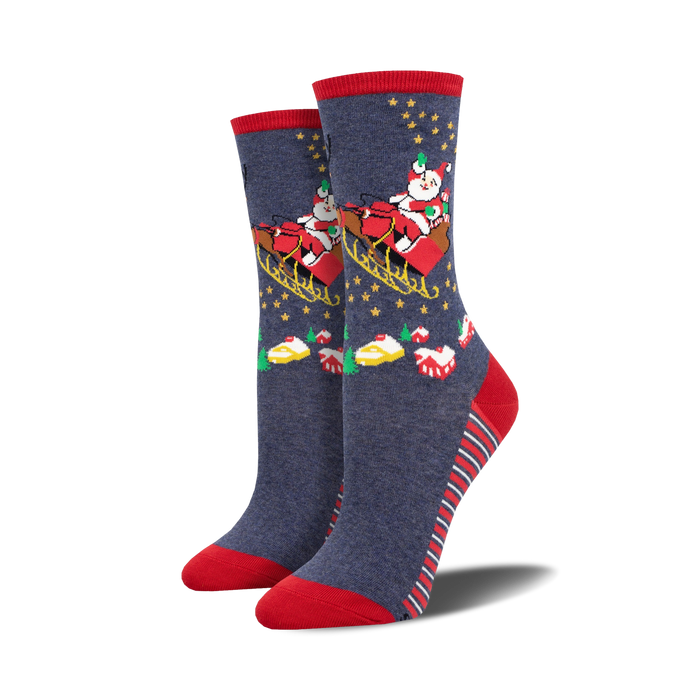 Pair of women's crew socks in navy blue with red accents.  Design features Santa in a sleigh with stars and Christmas treats.