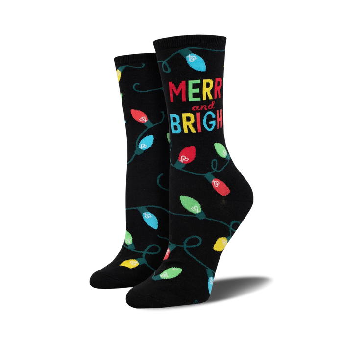 A pair of black crew socks with colorful string lights and 'Merry and Bright' text. Perfect for the holiday season! }}