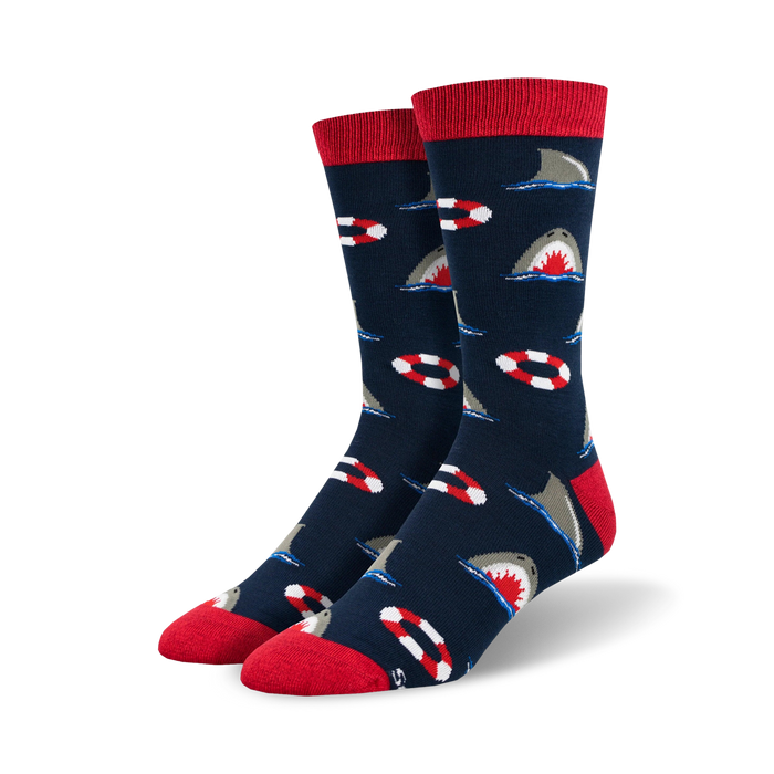 bright blue socks depict great white shark swimming around red and white lifepreservers    }}