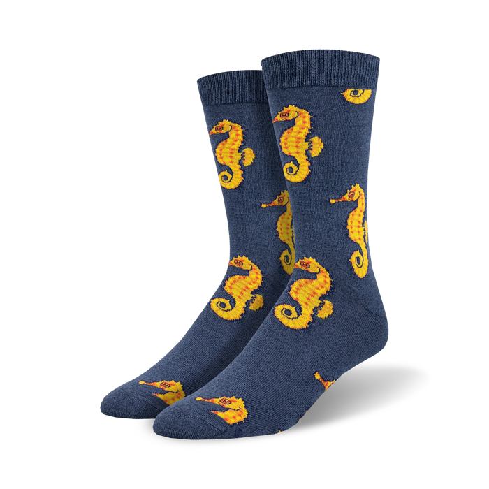 Pair of navy blue crew socks featuring a repeating pattern of yellow seahorses. Made from a bamboo blend. }}