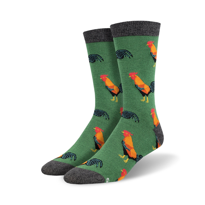 Pair of crew socks with a green background and colorful rooster design.  The socks have a grey cuff.