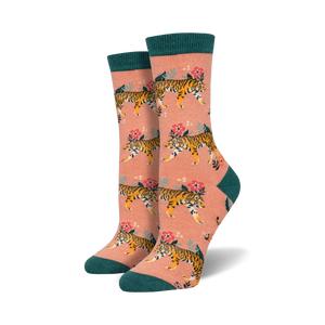 Lifestyle shot of a woman's feet wearing peach-colored Tiger Floral Bamboo socks with teal cuffs.