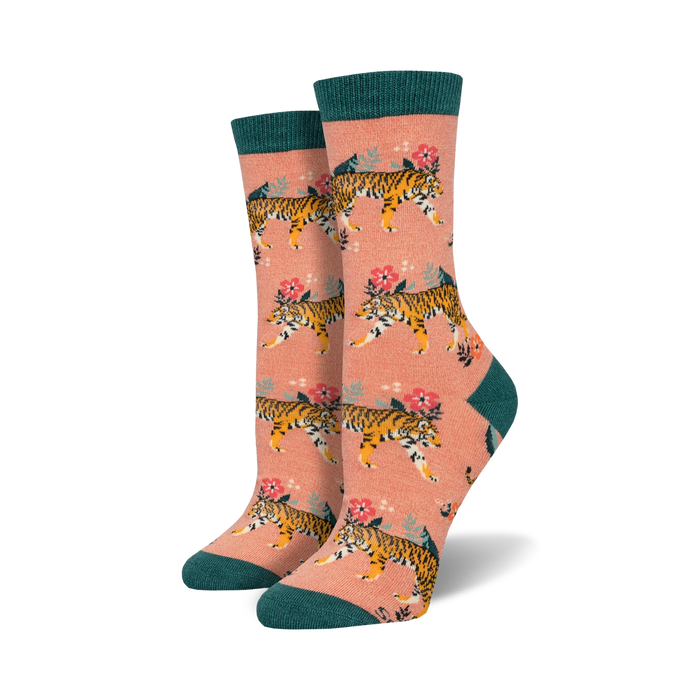 Lifestyle shot of a woman's feet wearing peach-colored Tiger Floral Bamboo socks with teal cuffs.