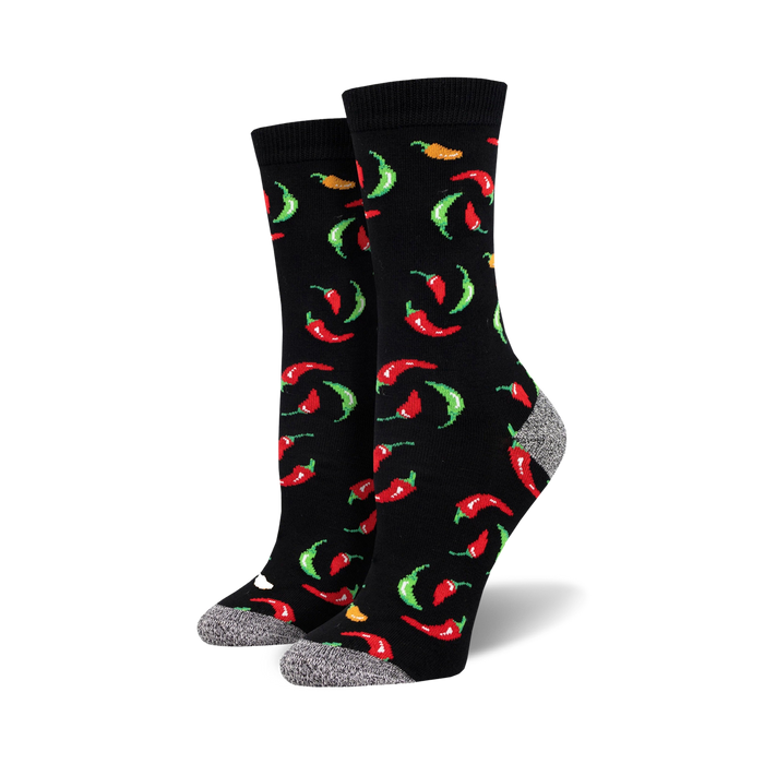Pair of black crew socks with a fun pattern of red, green, and orange chili peppers.  The socks have a gray reinforced heel and toe. }}