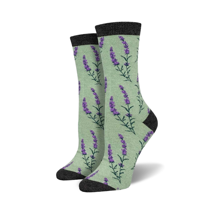 Pair of women's crew socks. Pale green background with purple lavender sprigs. Dark grey cuff.