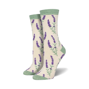 Close-up view of a pair of cream-colored crew socks with purple lavender sprigs. Light green cuffs.