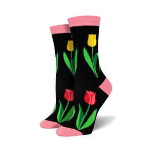 Pair of women's crew socks. Black background with red, yellow tulips and green leaves. Pink top trim.