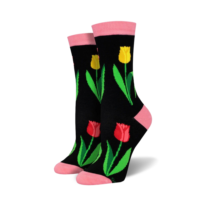 black crew socks with colorful tulips pattern, pink toes and heels.   