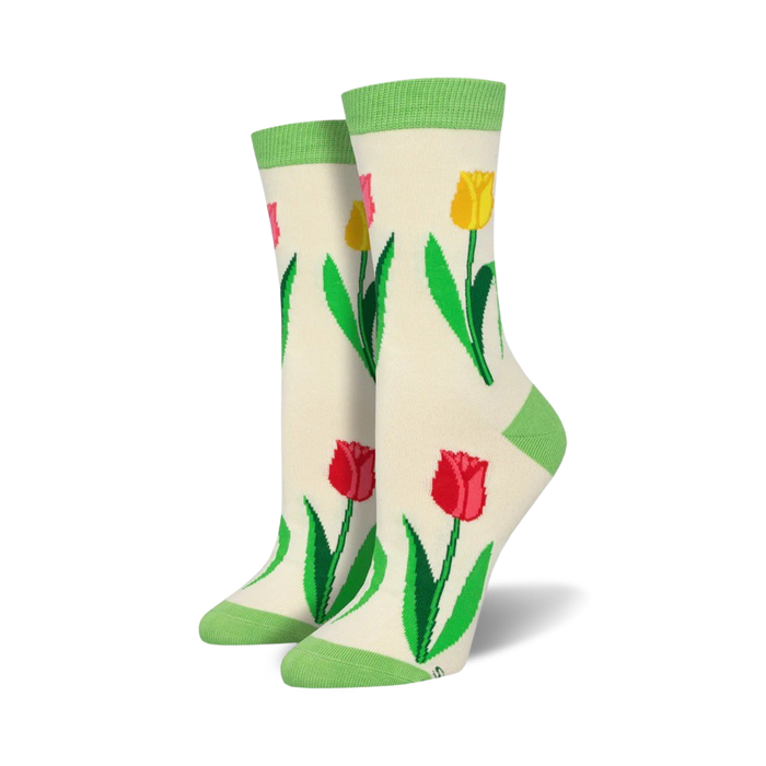 Close-up view of a pair of cream-colored Spring Tulip Bamboo socks with light green top trim.