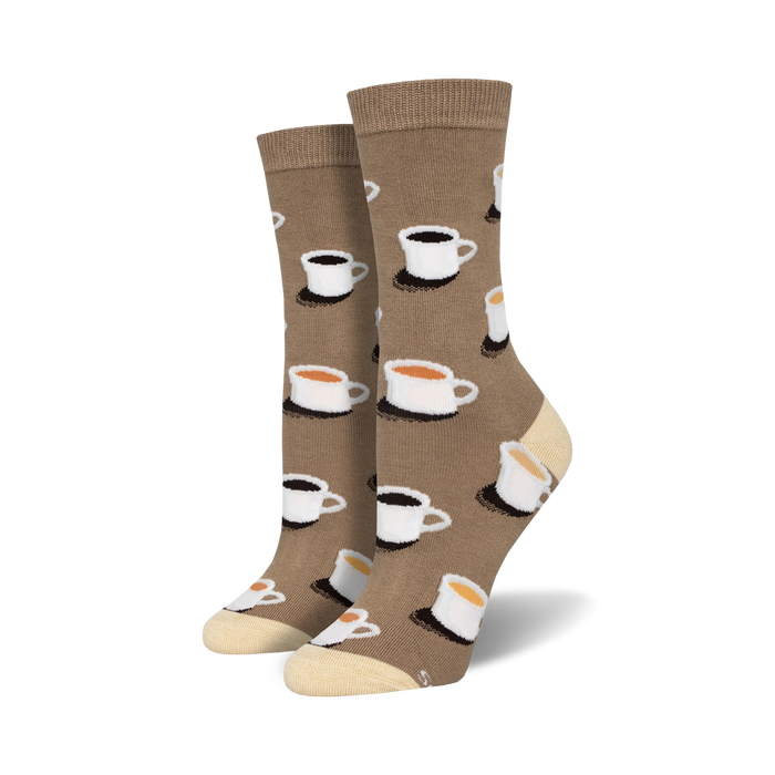 Pair of brown crew socks with a pattern of white coffee cups containing coffee or tea.  Cream-colored soles. }}