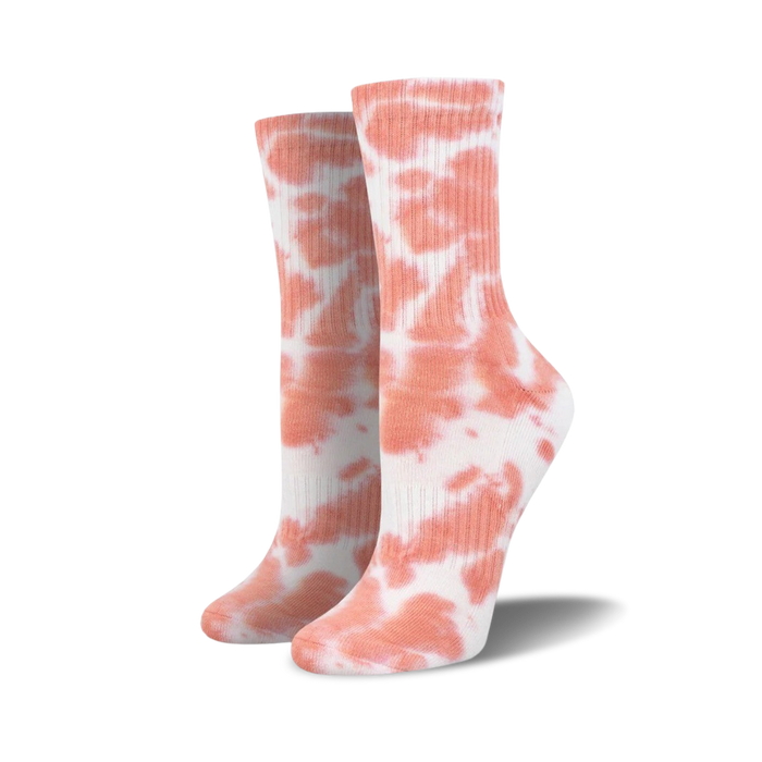 Pair of coral tie-dye athletic crew socks on a white background.