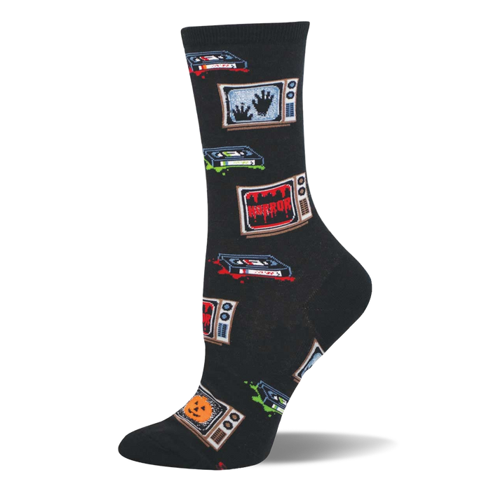 Black crew socks with retro TVs showing 'HORROR', spooky hands, and jack-o'-lanterns, plus VHS tapes with red and green splatters. }}